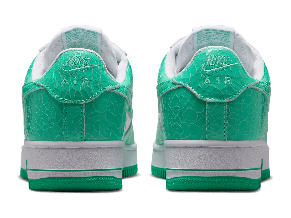 Nike Air Force 1 Low Menta and White, both heels, crackled green leather with embroidered Nike Air on the heel tab