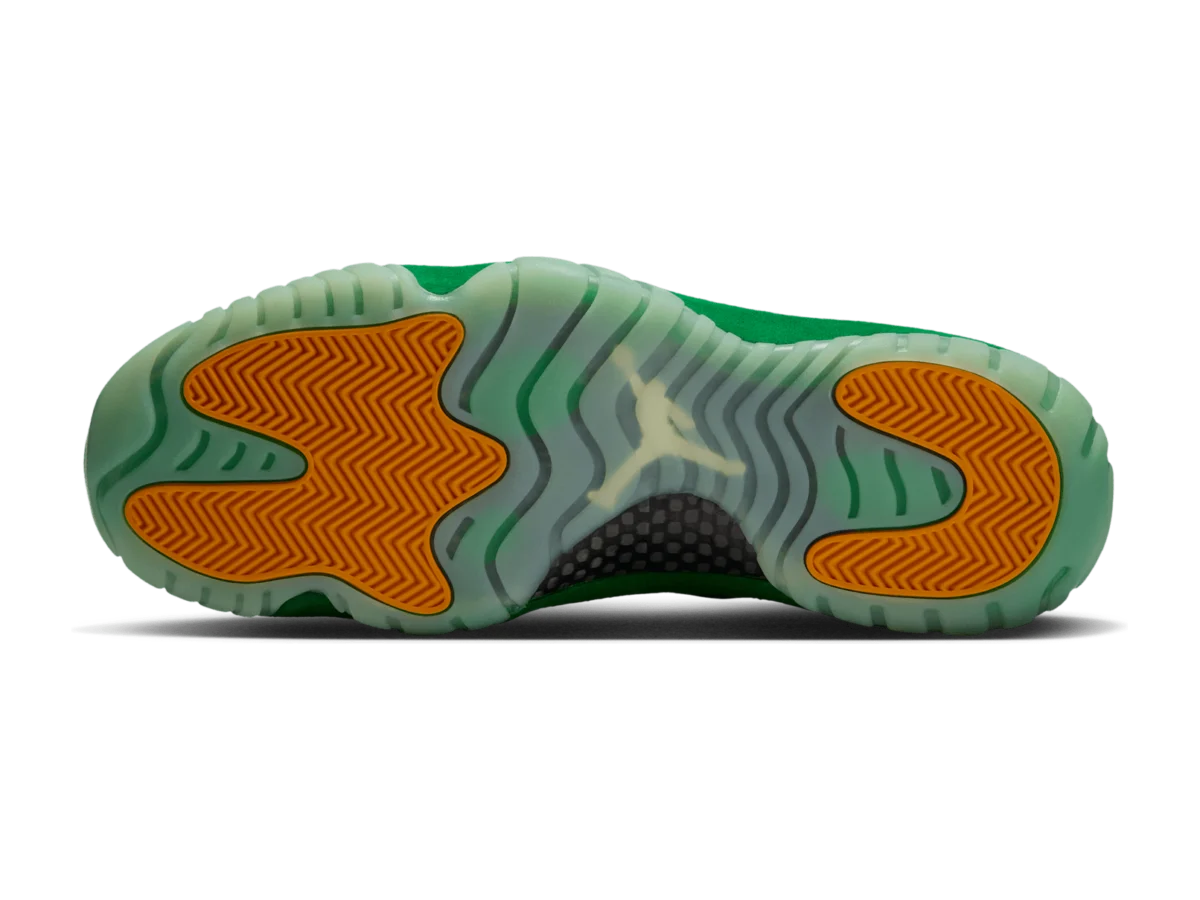 Air Jordan 11 Green Screen outsole, translucent pale green with orange traction pods and a Jumpman at the centre