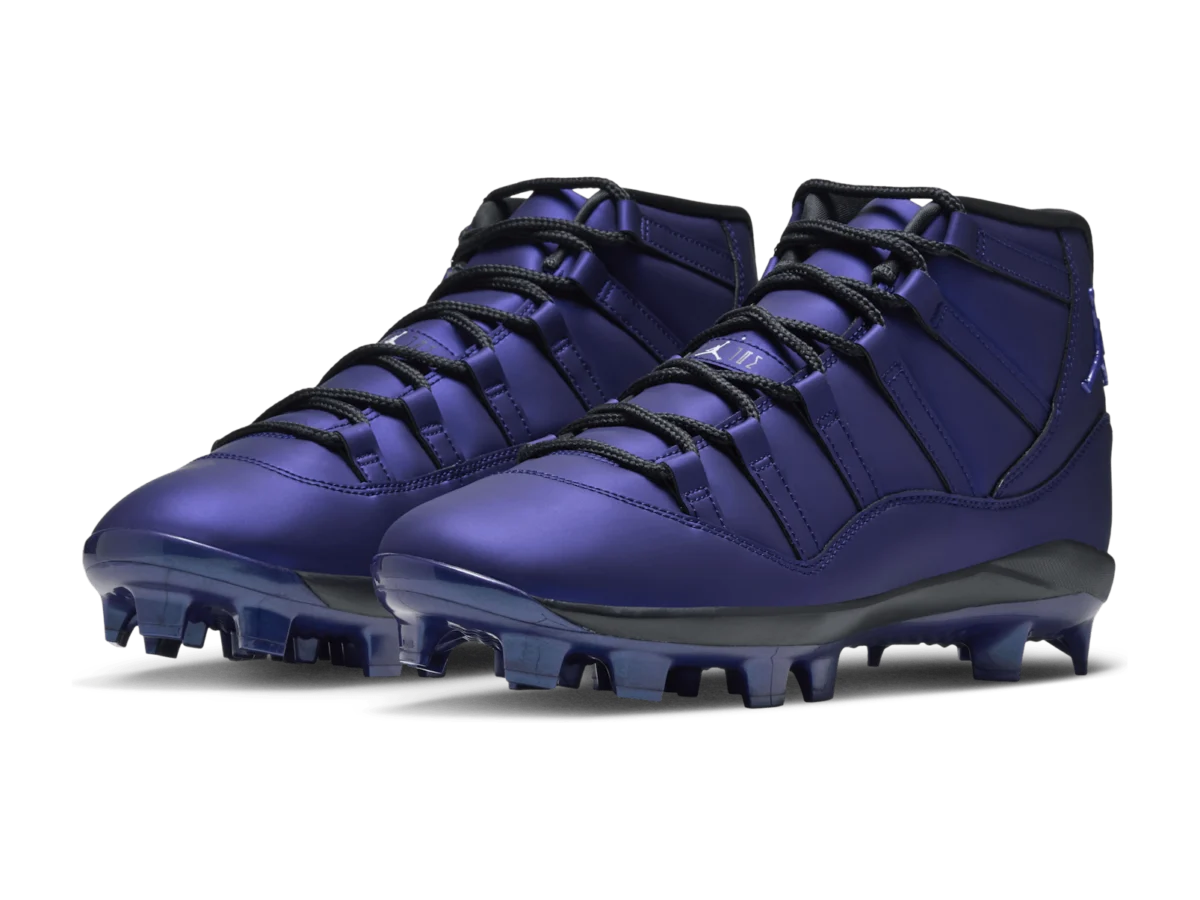 Pair of Jordan 11 MCS Space Jam baseball cleats in lapis and black
